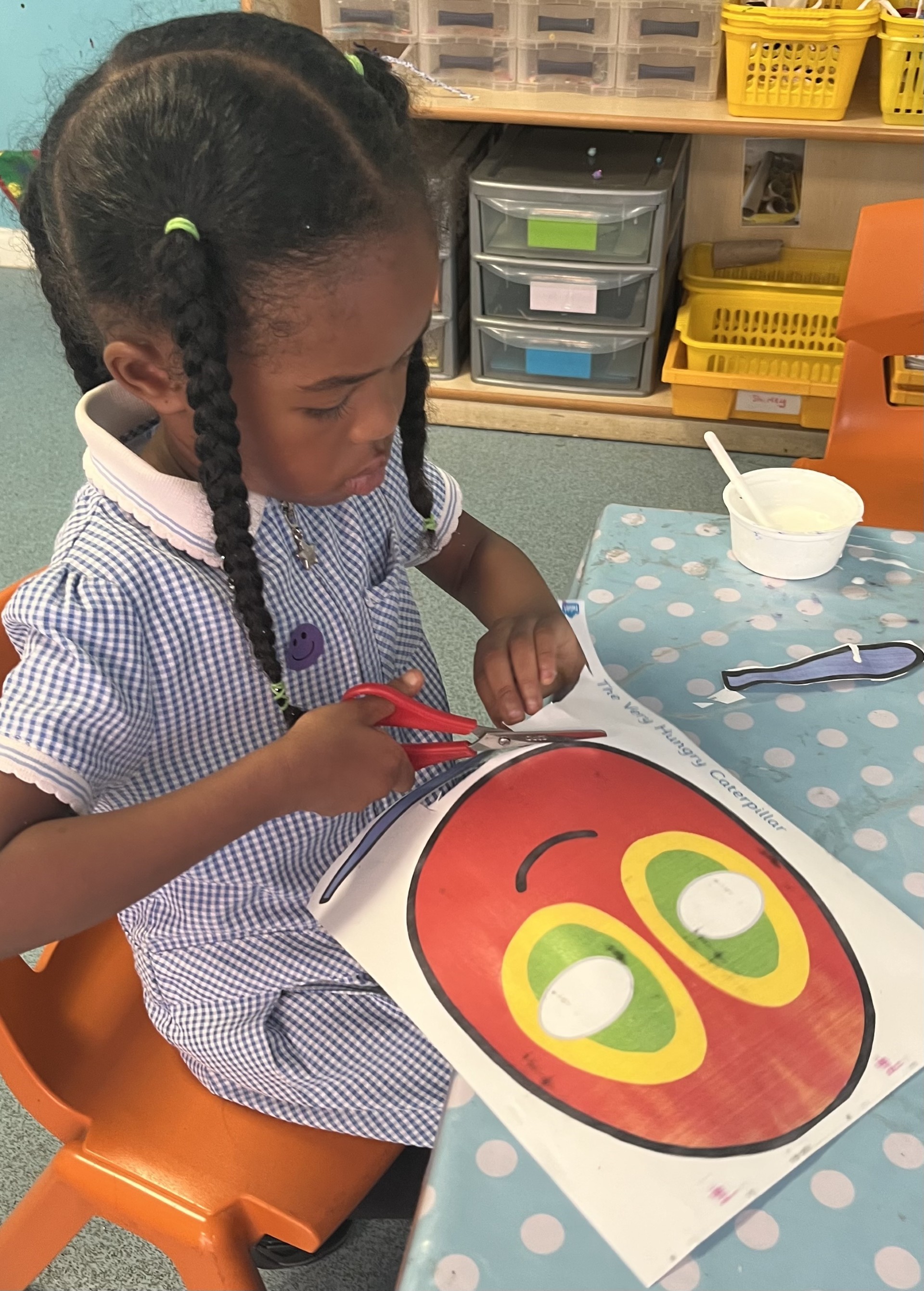 Sycamore Nursery child cutting out mask