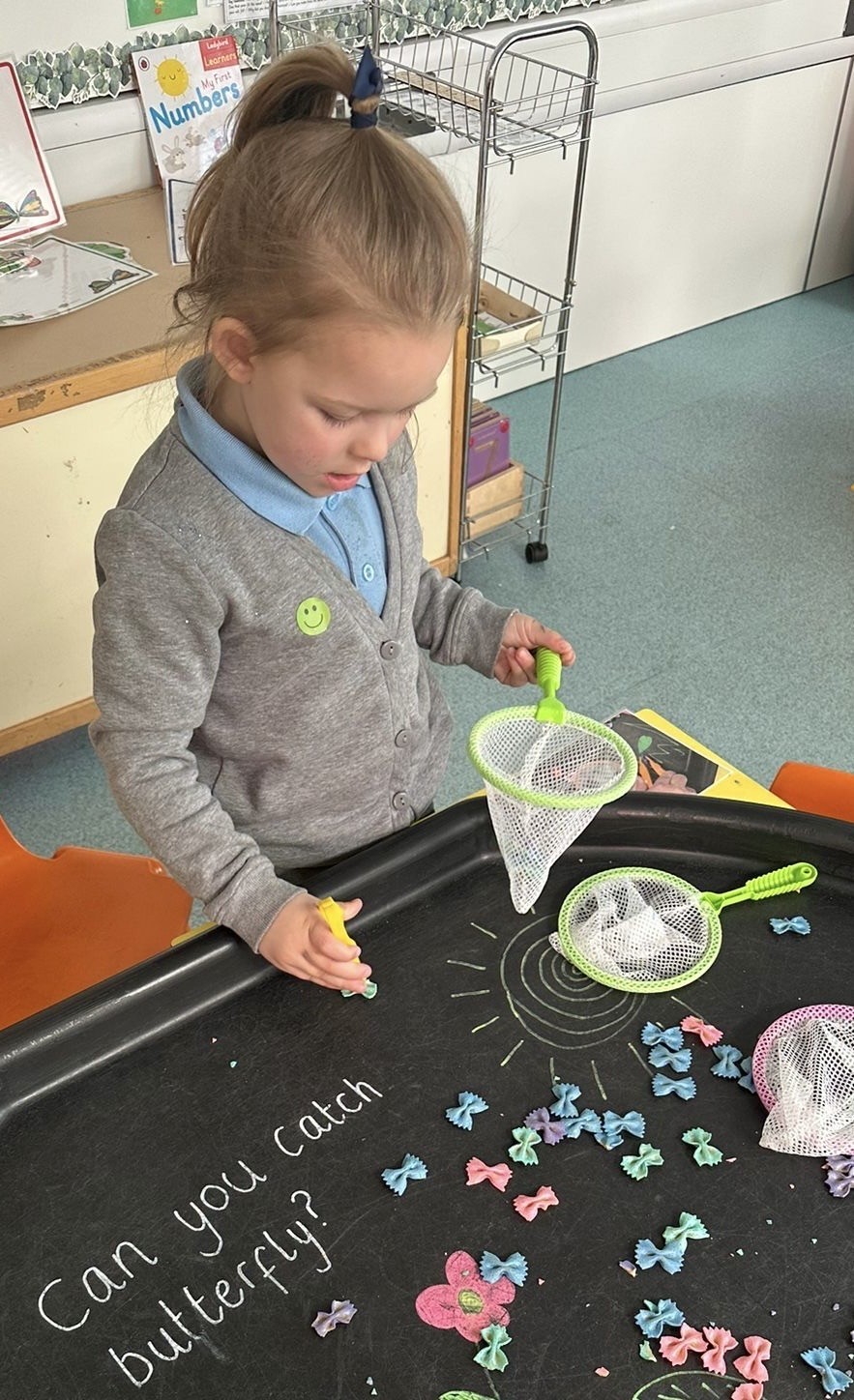 Sycamore Nursery child inside butterfly display