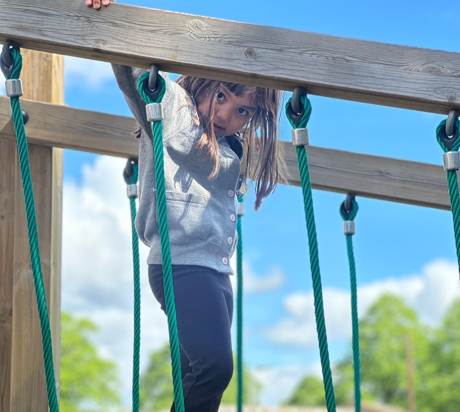 Sycamore Nursery child on climbing bridge