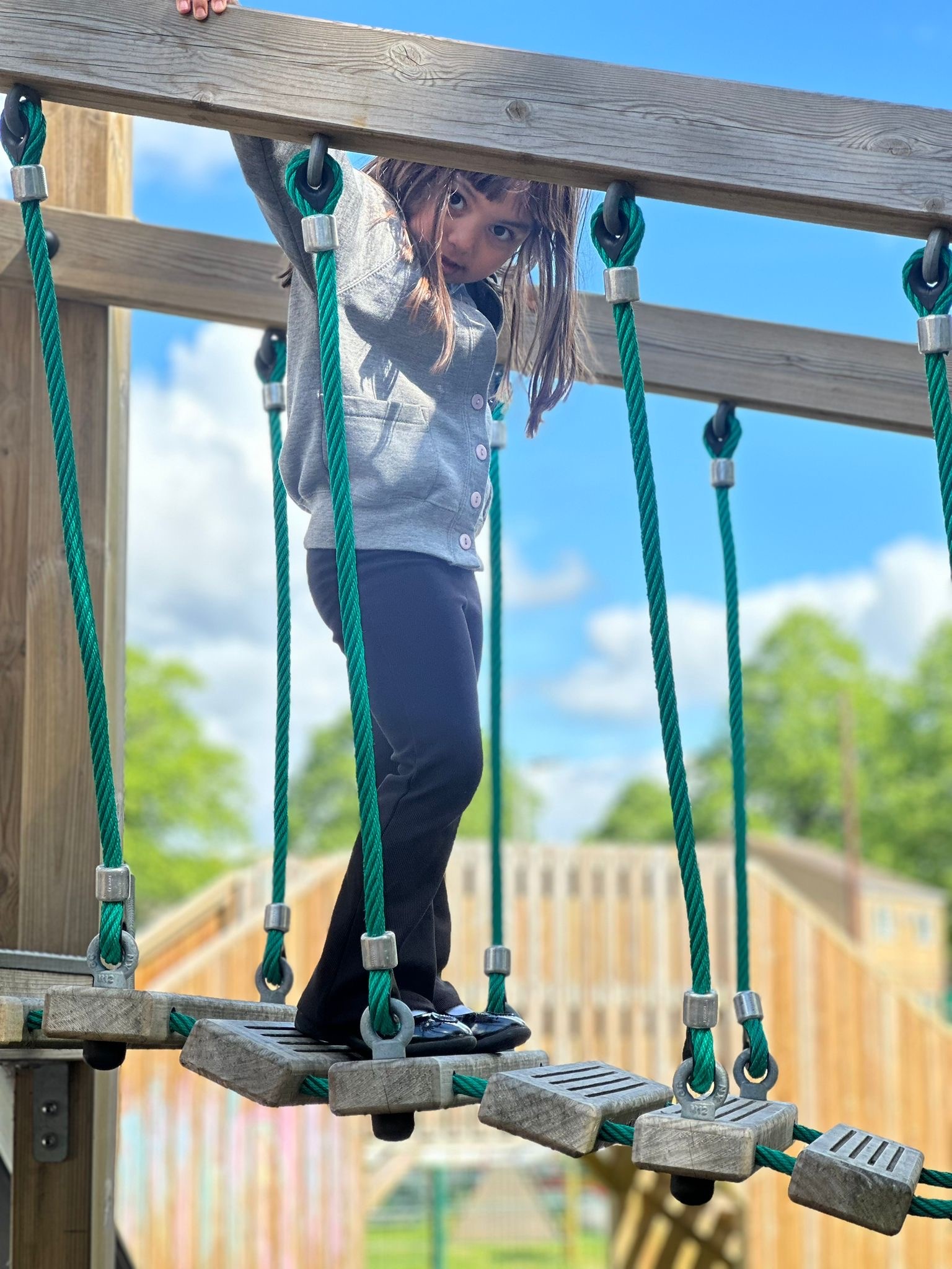 Sycamore Nursery child on climbing bridge
