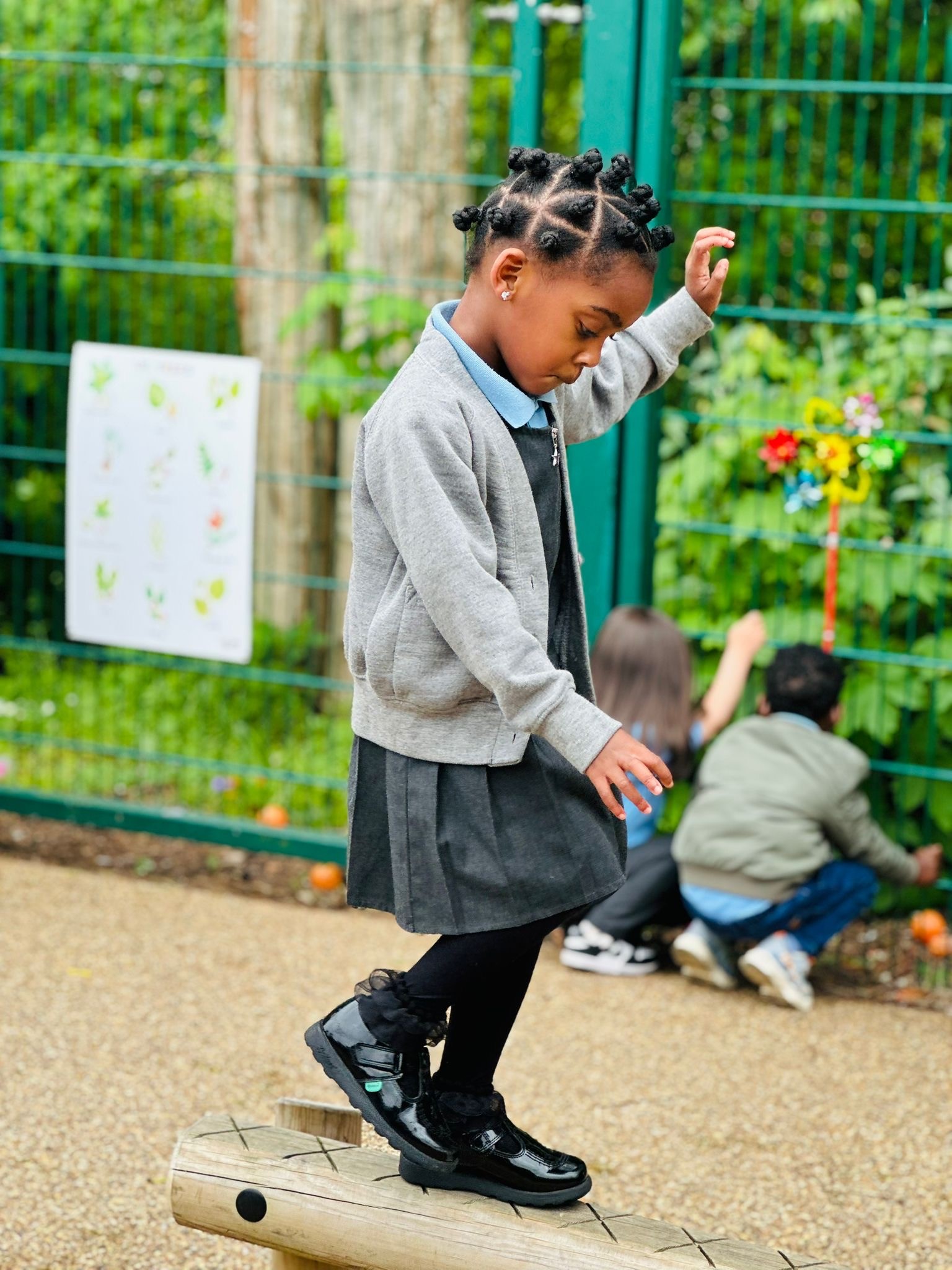 Sycamore Nursery child on wooden beam