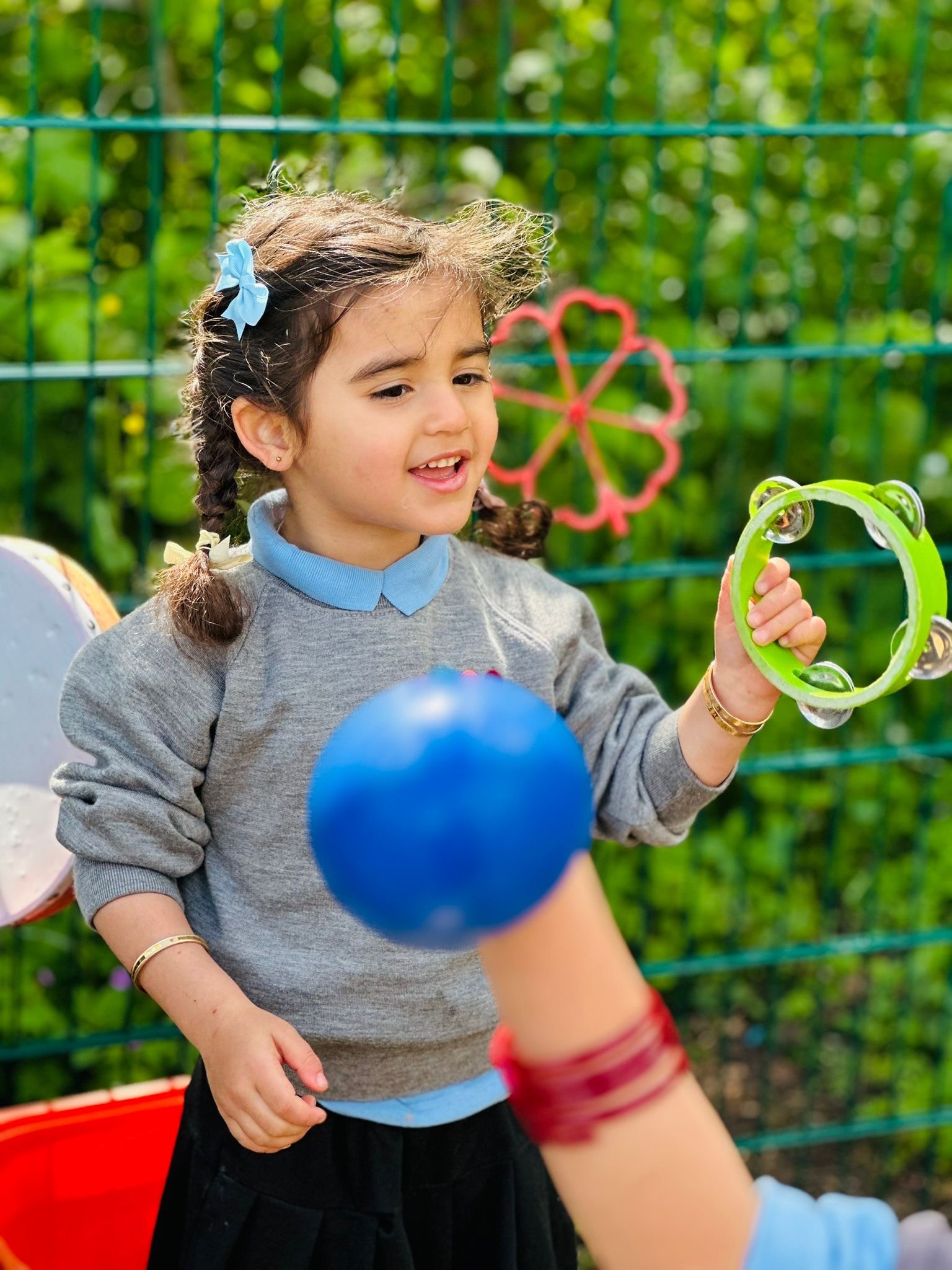 Sycamore Nursery child with tamborine