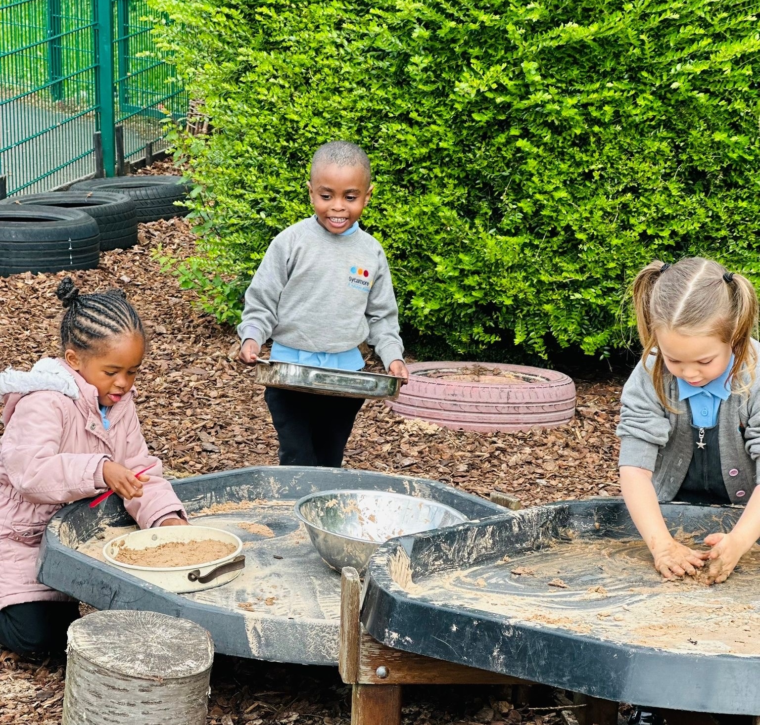 Sycamore Nursery children making mud pies