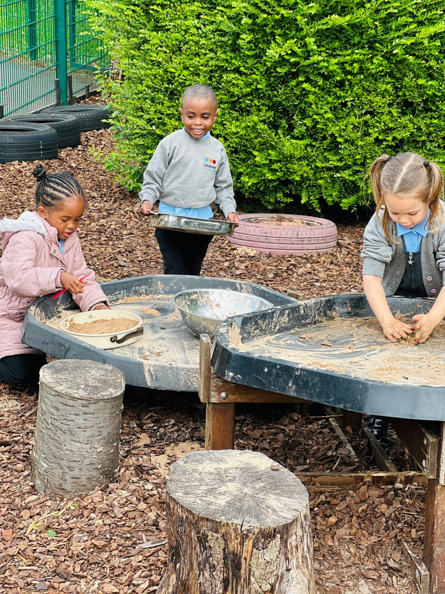 Sycamore Nursery children making mud pies