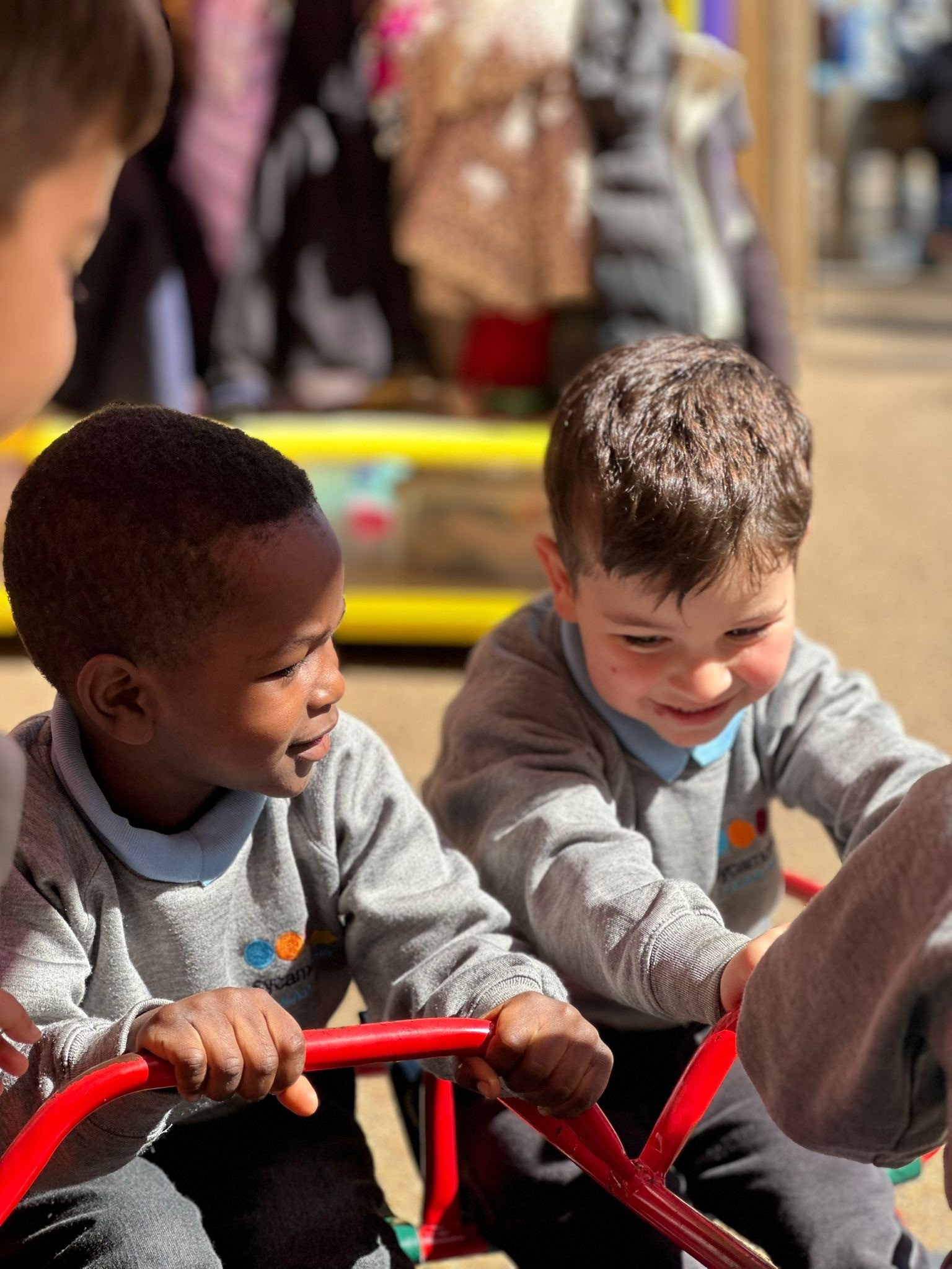 Sycamore Nursery children on frame