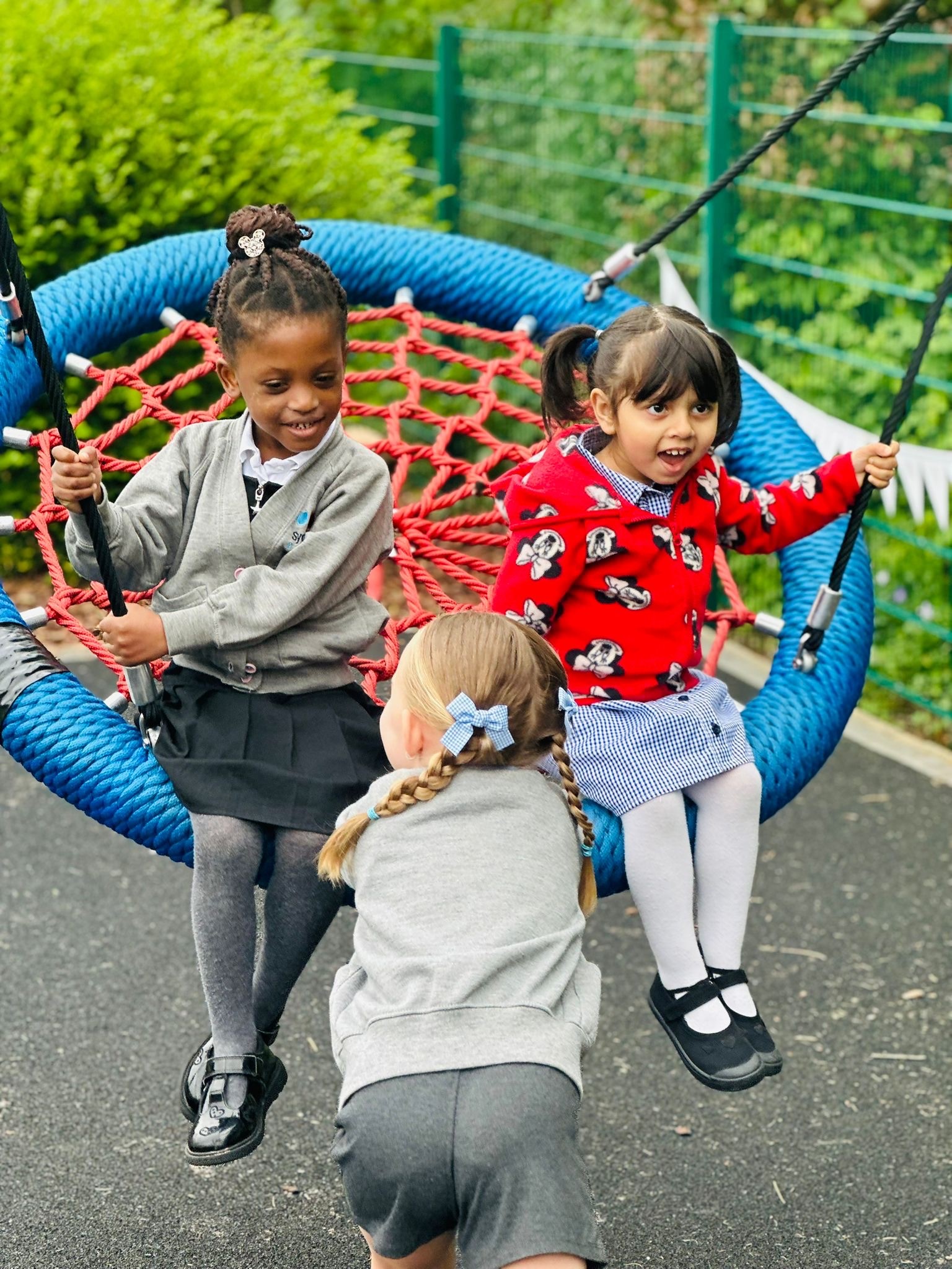 Sycamore Nursery children on swing