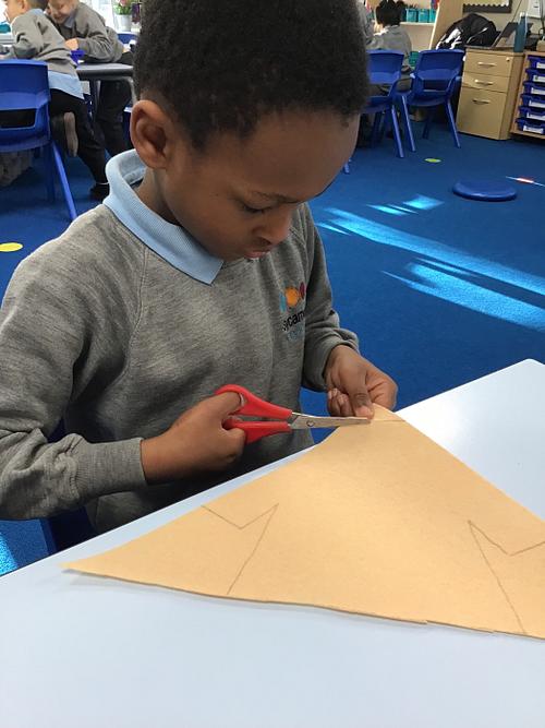 DT – boy cutting