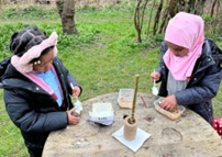 Pupils outside at table